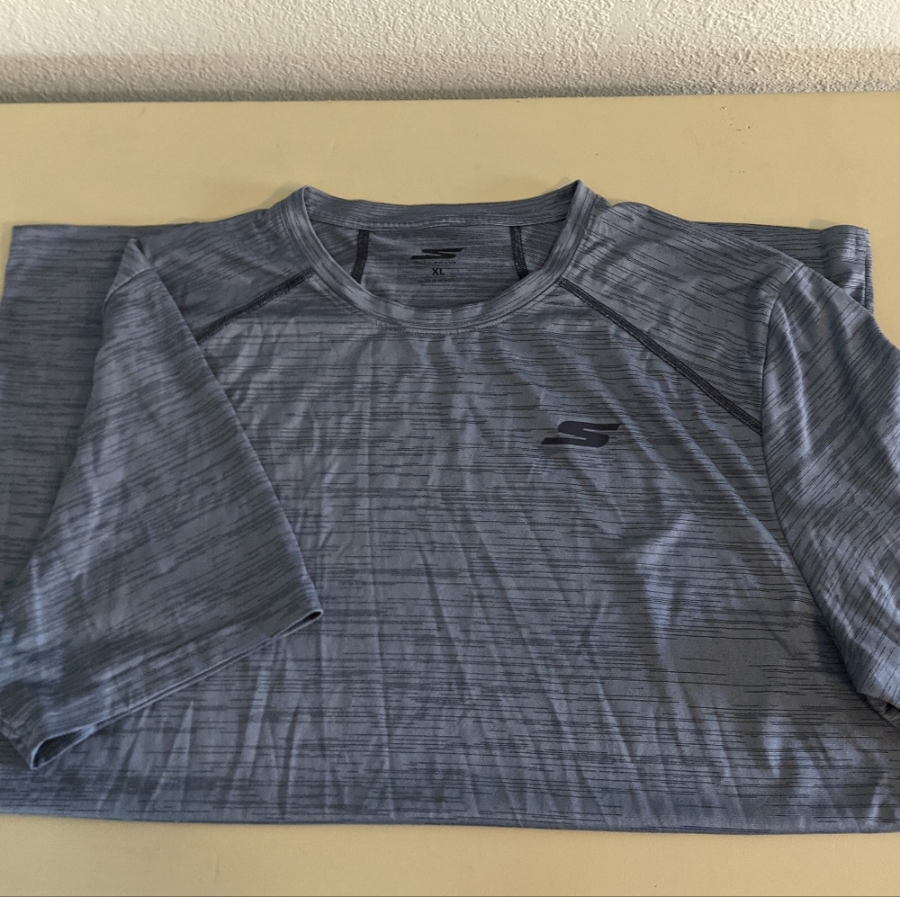 Skechers men's T-shirt. This is a very light weight shirt, size XLarge